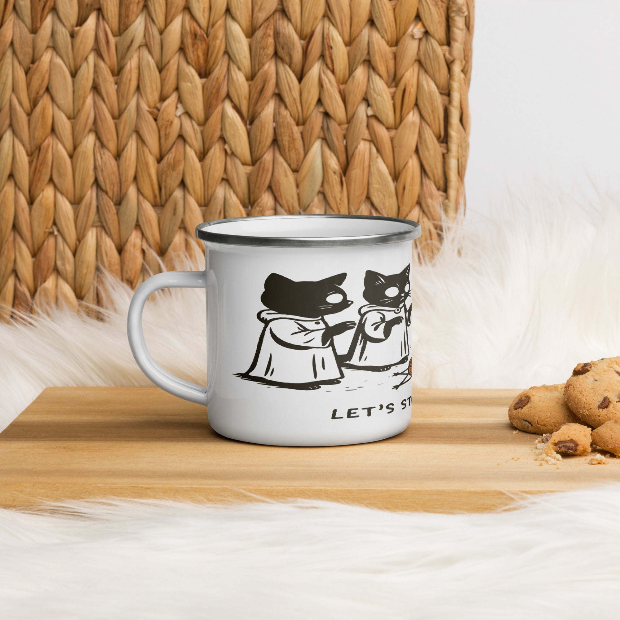 White enamel camp mug with black rim featuring illustrated robed cats gathered around a candle and the text “Let’s Start a Cult.”