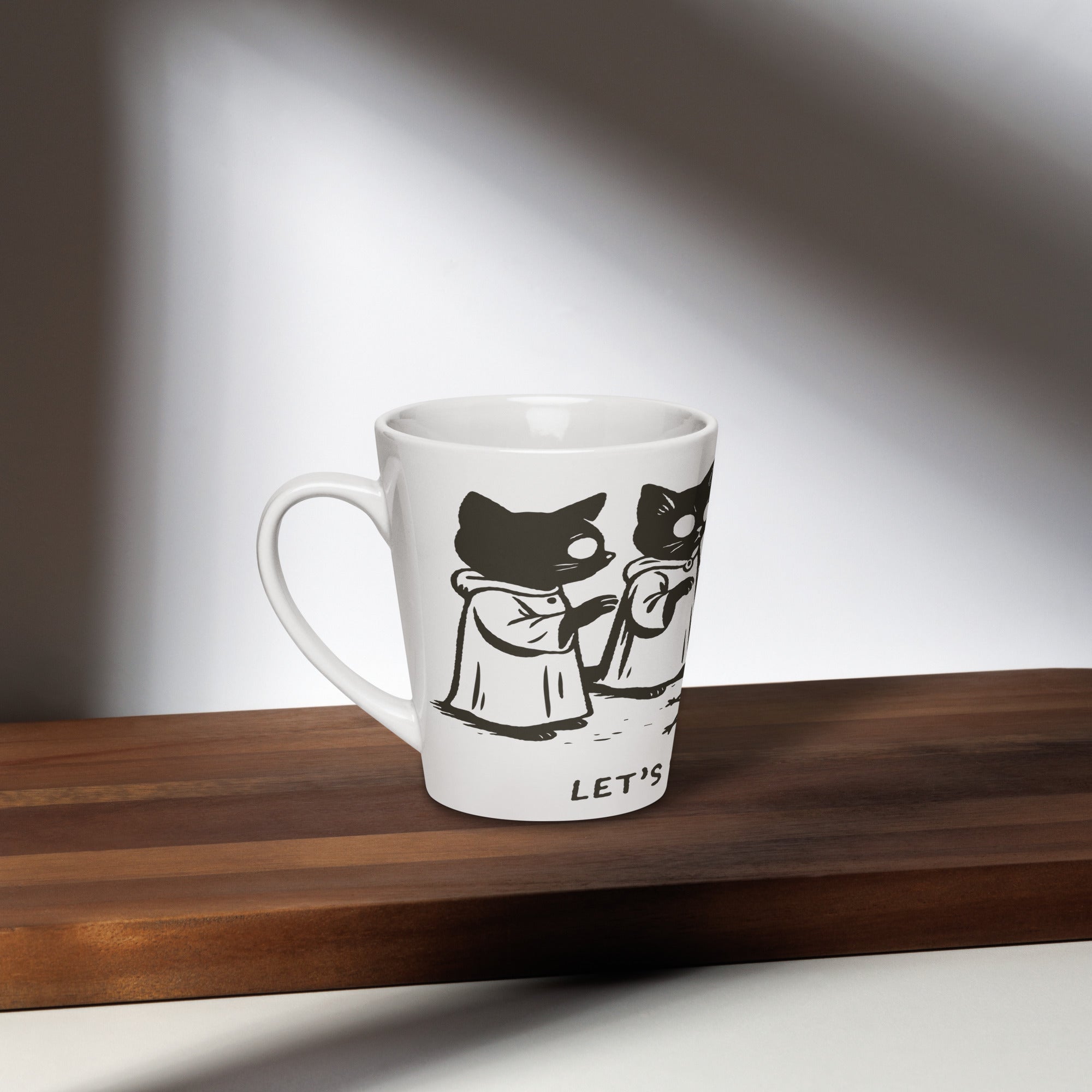 Tall ceramic latte mug featuring illustrated cats in robes gathered around a candle with the text “Let’s Start a Cult.”