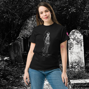Product mockupWoman wearing AETHEREUM CORPUS black t-shirt with white line art corpse drawing, posed in a gothic graveyard.