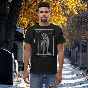 Man wearing a black Silent Vigil t-shirt with white line art of Death standing in a framed scene, graveyard path dusted with snow in the background.