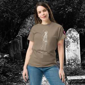 Woman wearing AETHEREUM CORPUS brown Savana t-shirt with white line art corpse drawing, posed in a gothic graveyard.