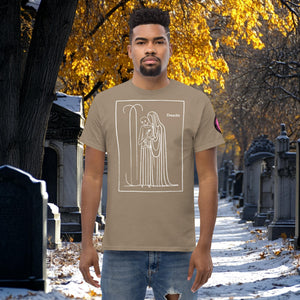 Man wearing a brown savana Silent Vigil t-shirt with white line art of Death standing in a framed scene, graveyard path dusted with snow in the background.