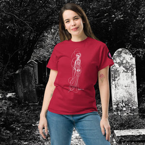 Woman wearing AETHEREUM CORPUS cardinal red t-shirt with white line art corpse drawing, posed in a gothic graveyard.