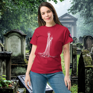 Man wearing a cardinal red Skeletal Serenity Classic Tee with white line art of Death holding flowers, standing in a gothic graveyard.