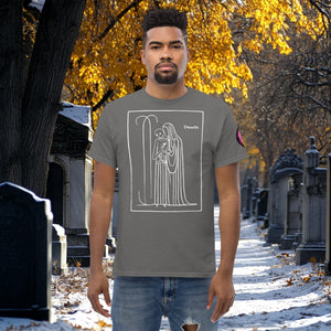 Man wearing a charcoal Silent Vigil t-shirt with white line art of Death standing in a framed scene, graveyard path dusted with snow in the background.