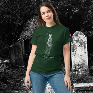 Woman wearing AETHEREUM CORPUS forest green t-shirt with white line art corpse drawing, posed in a gothic graveyard.