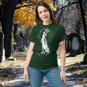 Woman wearing a forest green Wraith’s Reverie t-shirt with white line art of the Grim Reaper in graceful pose, surrounded by autumn trees and gravestones.