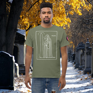 Man wearing a military green Silent Vigil t-shirt with white line art of Death standing in a framed scene, graveyard path dusted with snow in the background.