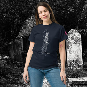 Woman wearing AETHEREUM CORPUS navy t-shirt with white line art corpse drawing, posed in a gothic graveyard.