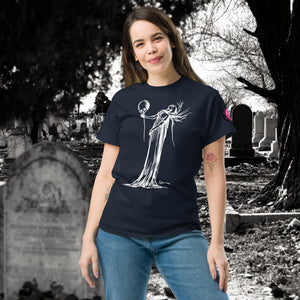 Woman wearing a navy Phantom’s Waltz t-shirt with white line art of a ghostly figure holding a skull, standing in a graveyard with headstones behind her.