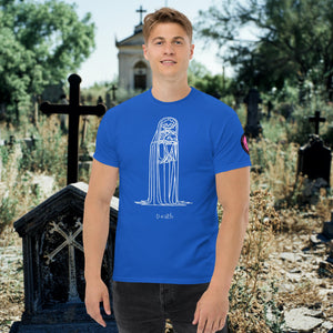 Man wearing a royal blue Solitary Embrace t-shirt with white line art of a skeleton cloaked in darkness, arms wrapped around itself, standing in a graveyard.