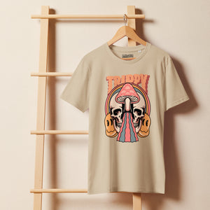 Mid-light organic cotton t-shirt showing a split skull divided by a pink mushroom, with flowing psychedelic shapes and small smiley faces.