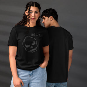 Crude hand-drawn skull with mismatched eye sockets and UGLY text in the upper corner, anti-polish graphic design, Artificial Perdition apparel