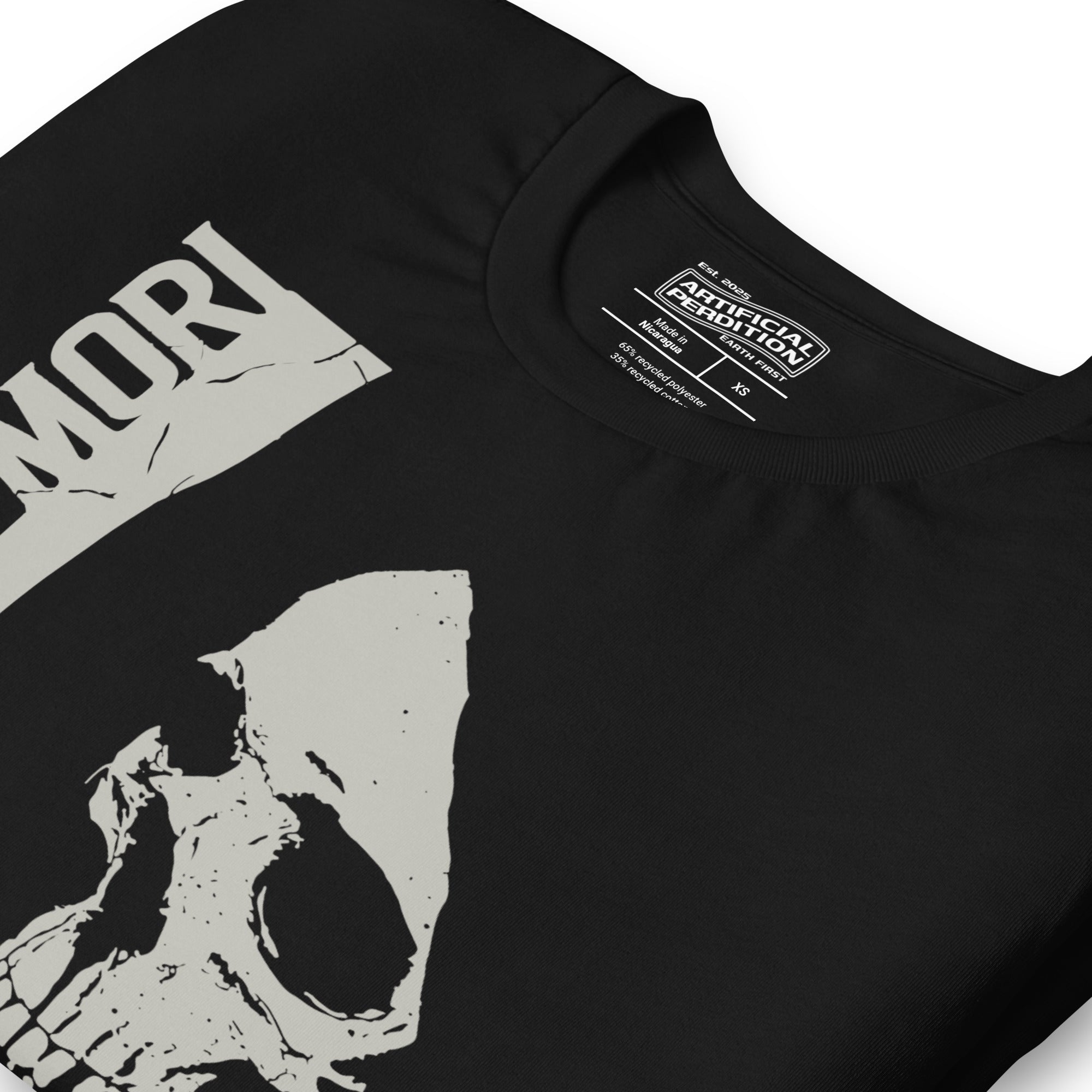 Cracked skull illustration in tombstone grey with vertical Memento Mori text and Remember Death translation, Artificial Perdition apparel