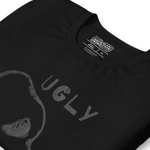 Crude hand-drawn skull with mismatched eye sockets and UGLY text in the upper corner, anti-polish graphic design, Artificial Perdition apparel
