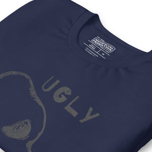 Crude hand-drawn skull with mismatched eye sockets and UGLY text in the upper corner, anti-polish graphic design, Artificial Perdition apparel