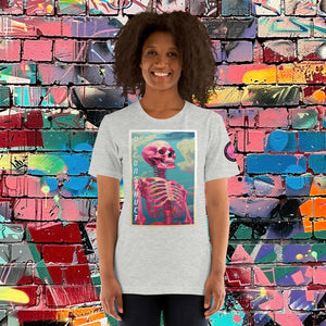 Woman wearing an athletic heather Deconstruct Core Tee with colorful skeletal design gazing upward, standing before a vibrant graffiti wall.