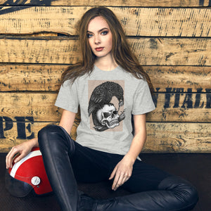 Graphite illustration of a black corvid perched on a human skull removing the eye, sprouting branch beside it, Last Look, Artificial Perdition apparel