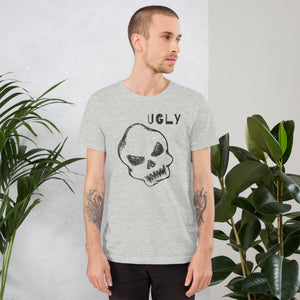 Crude hand-drawn skull with mismatched eye sockets and UGLY text in the upper corner, anti-polish graphic design, Artificial Perdition apparel
