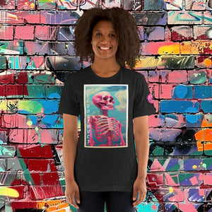 Woman wearing a black heather Deconstruct Core Tee with colorful skeletal design gazing upward, standing before a vibrant graffiti wall.