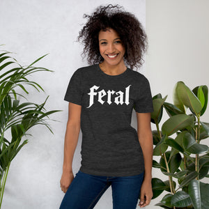 Feral in white blackletter font on dark heather grey t-shirt, bold single word graphic design, Artificial Perdition apparel