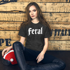 Feral in white blackletter font on dark heather grey t-shirt, bold single word graphic design, Artificial Perdition apparel