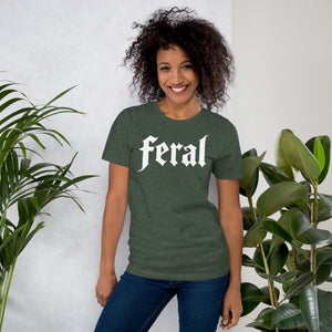 Feral in white blackletter font on dark heather grey t-shirt, bold single word graphic design, Artificial Perdition apparelProduct mockup