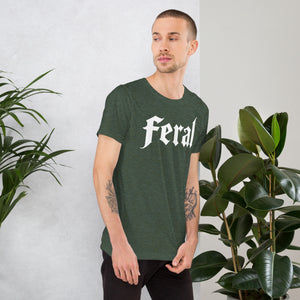 Feral in white blackletter font on dark heather grey t-shirt, bold single word graphic design, Artificial Perdition apparel