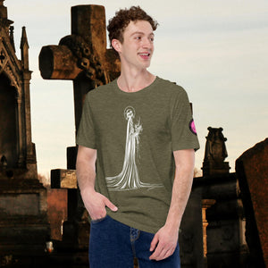 Man wearing a heather olive Skeletal Serenity Core Tee with minimalist Grim Reaper design, surrounded by weathered tombs and greenery.