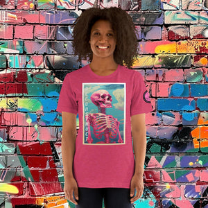 Woman wearing a heather raspberry Deconstruct Core Tee with colorful skeletal design gazing upward, standing before a vibrant graffiti wall.