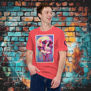 A man wearing a heather red Discordance Core Tee with vibrant skull dripping in color, standing before a blue and orange graffiti wall.