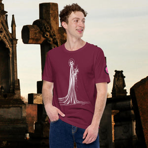 Man wearing a maroon Skeletal Serenity Core Tee with minimalist Grim Reaper design, surrounded by weathered tombs and greenery.