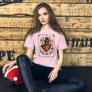 Tarot card illustration numbered X with an anatomical heart in bloom surrounded by wildflowers and vines, Amor Fati, Artificial Perdition apparel