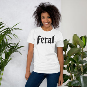 Feral in white blackletter font on dark heather grey t-shirt, bold single word graphic design, Artificial Perdition apparel