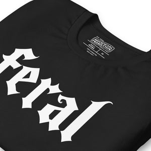 Feral in white blackletter font on dark heather grey t-shirt, bold single word graphic design, Artificial Perdition apparel