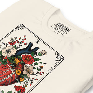 Tarot card illustration numbered X with an anatomical heart in bloom surrounded by wildflowers and vines, Amor Fati, Artificial Perdition apparel