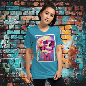 Woman wearing an aqua triblend Discordance Premium Tee with surreal neon skull artwork against a colorful graffiti backdrop.