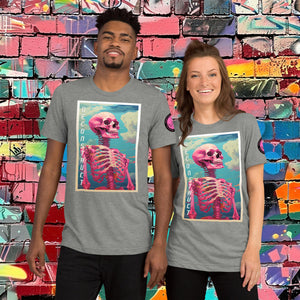 Woman wearing an athletic grey Triblend Deconstruct Core Tee with colorful skeletal design gazing upward, standing before a vibrant graffiti wall.