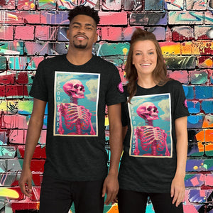 Woman wearing a charcoal black Triblend Deconstruct Core Tee with colorful skeletal design gazing upward, standing before a vibrant graffiti wall.
