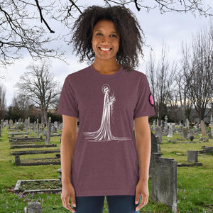 A woman wearing a maroon tri-blend Skeletal Serenity Premium Tee with elegant line art of Death holding flowers, sunset cemetery backdrop.