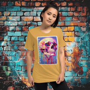 Woman wearing a mustard triblend Discordance Premium Tee with surreal neon skull artwork against a colorful graffiti backdrop.