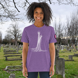 A woman wearing a purple tri-blend Skeletal Serenity Premium Tee with elegant line art of Death holding flowers, sunset cemetery backdrop.