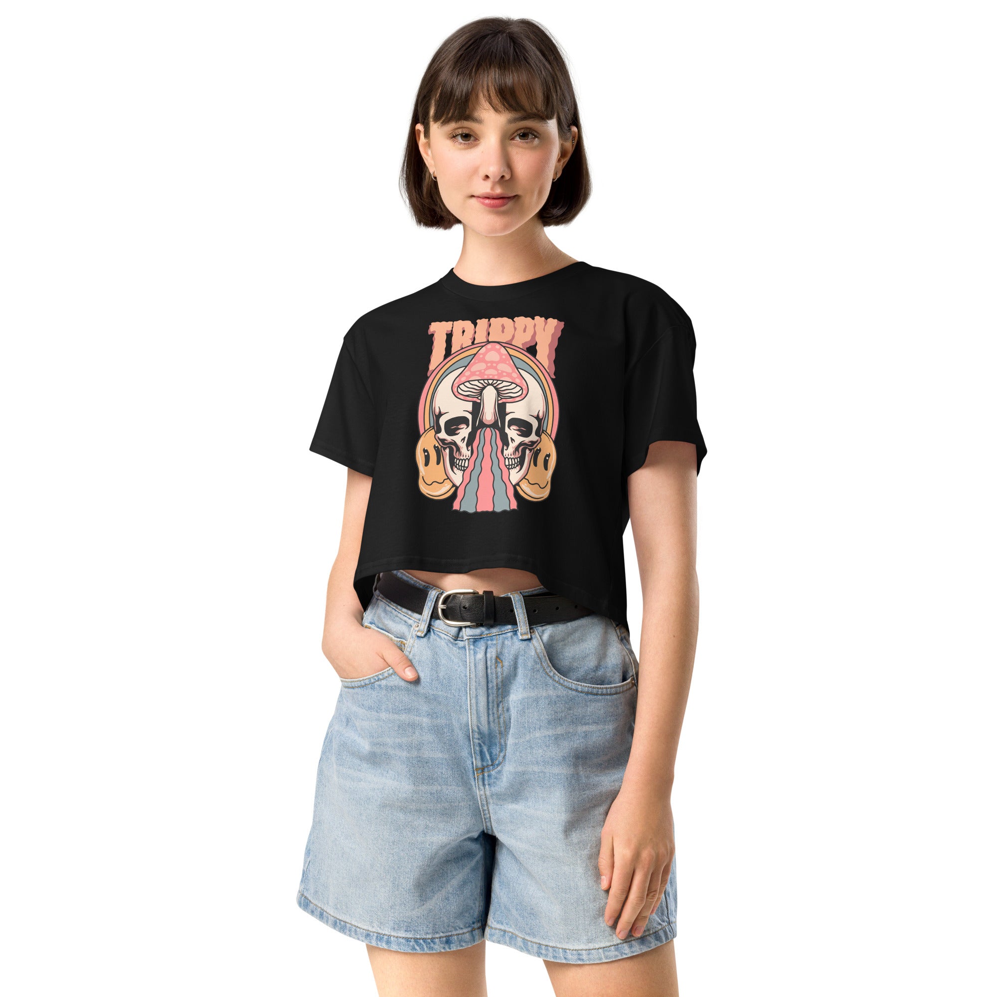Cropped tee featuring a split skull and mushroom design with melting psychedelic color and smiley faces. Soft combed cotton, eco-friendly inks, playful surreal vibe.