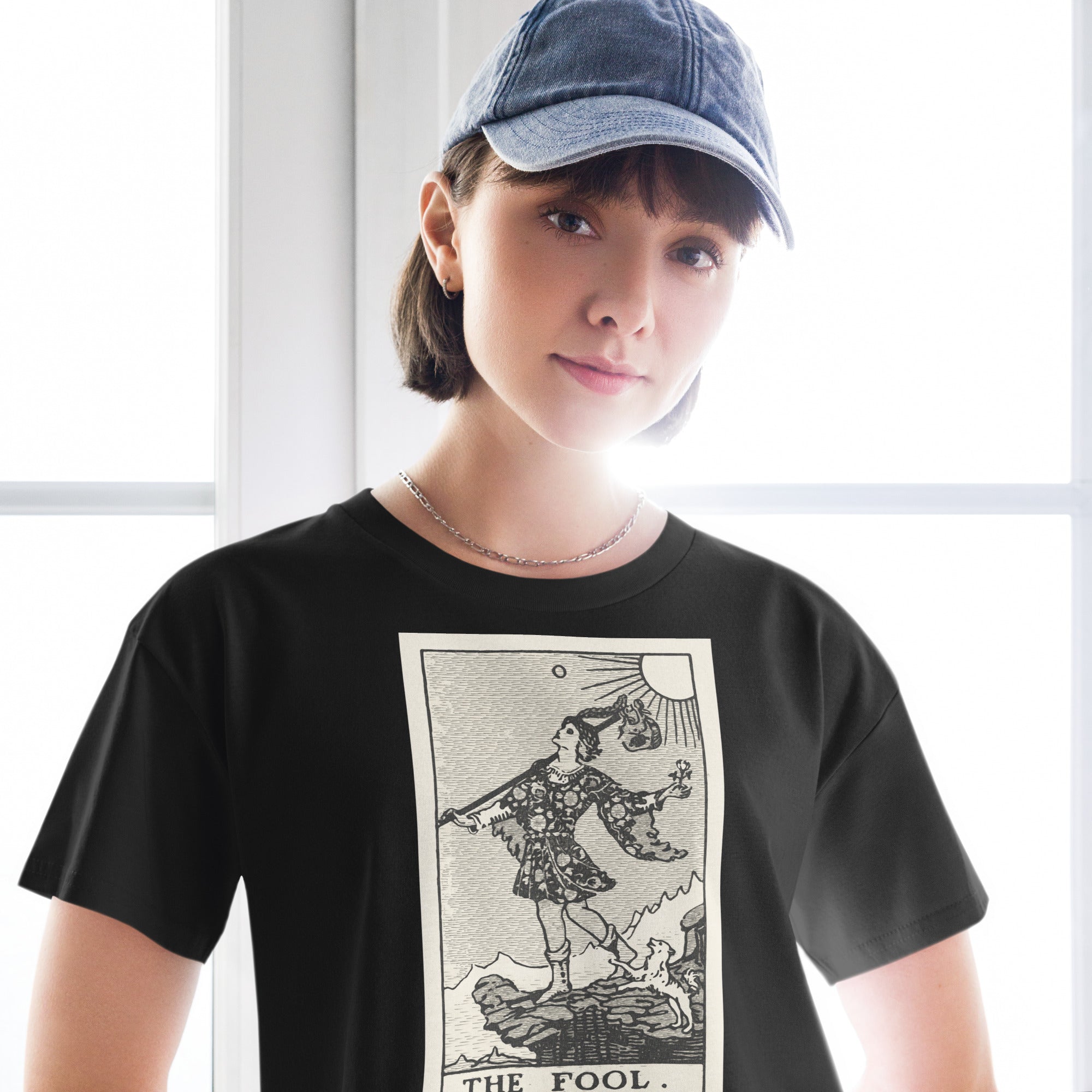 Cropped cotton t-shirt featuring The Fool tarot card rendered in modern woodcut style.