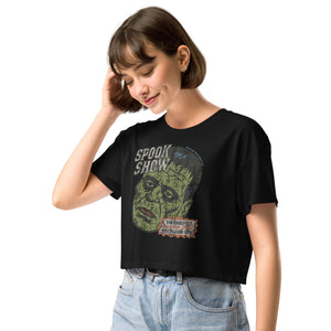 A side view of a distressed Frankenstein head with “Spook Show” on premium black crop top.