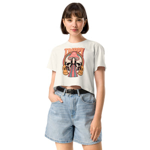 Cropped tee featuring a split skull and mushroom design with melting psychedelic color and smiley faces. Soft combed cotton, eco-friendly inks, playful surreal vibe.