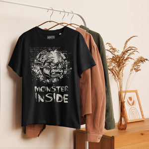 Black fitted organic cotton t-shirt featuring horned monster inside a ritual circle with mystical script and “Monster Inside” text.