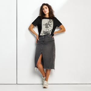 Fitted organic cotton t-shirt featuring The Fool tarot card illustration in high-contrast woodcut rendering.