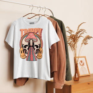 Fitted organic cotton t-shirt with a split skull divided by a pink mushroom, flowing psychedelic shapes, and small smiley faces.