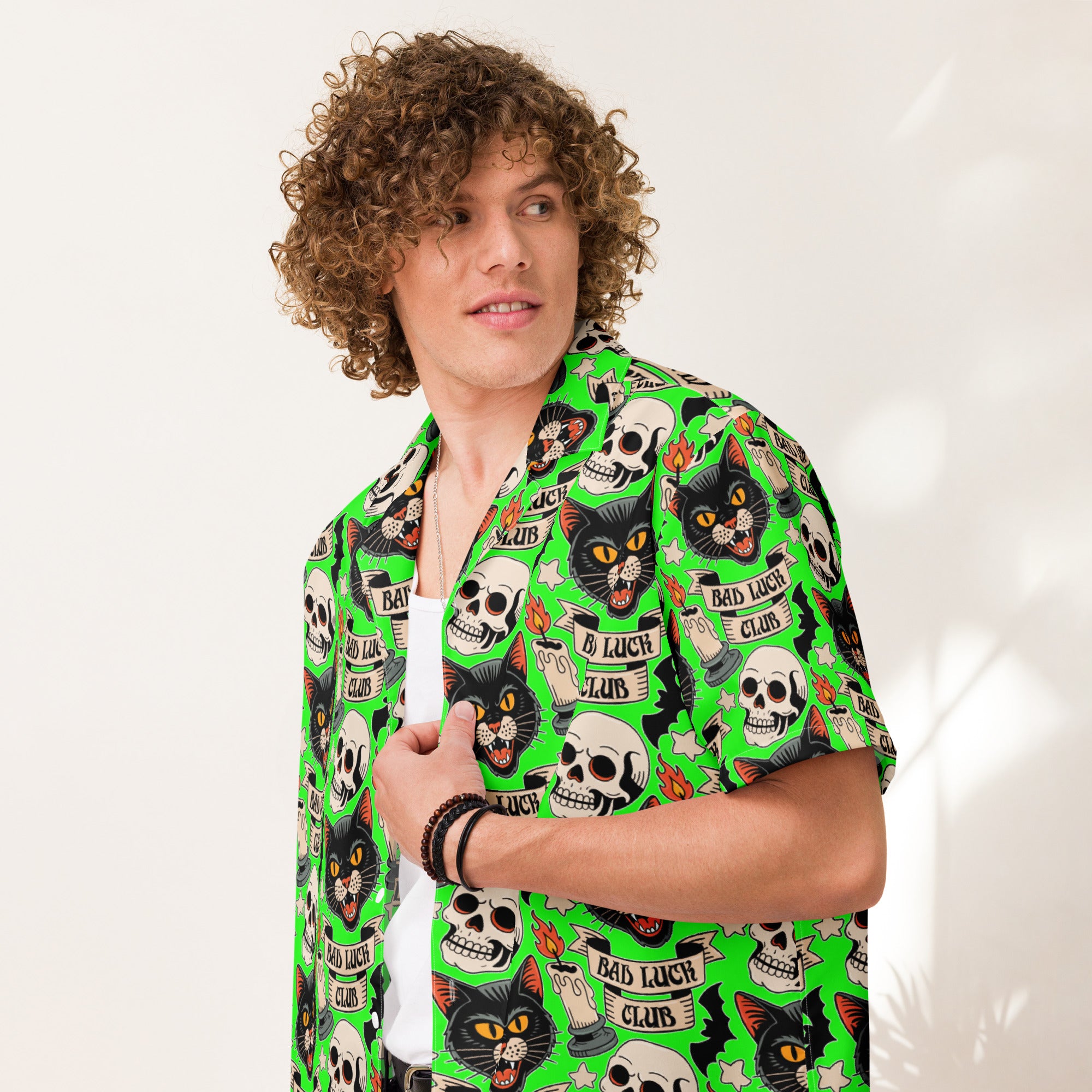 Bad Luck Club all-over print shirt, repeating tattoo flash pattern with black cats, skulls, candles and bats on screaming green, Artificial Perdition
